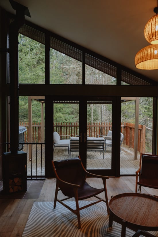 Unfurl living room area looking out towards the decking at Forest Holidays