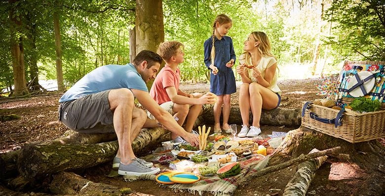 Family having a picnic in the forest